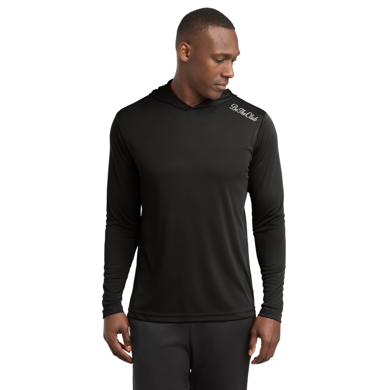 Man wearing a black long-sleeve shirt with a brand logo on a white background