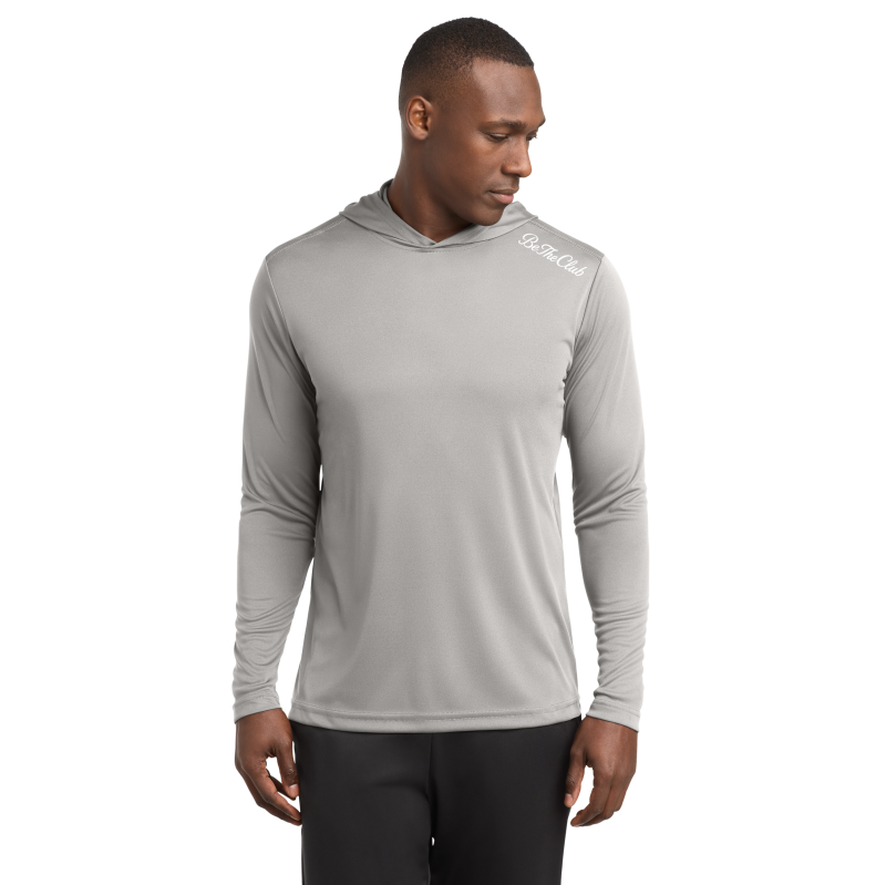 Man wearing a gray hoodie with a brand logo on a white background