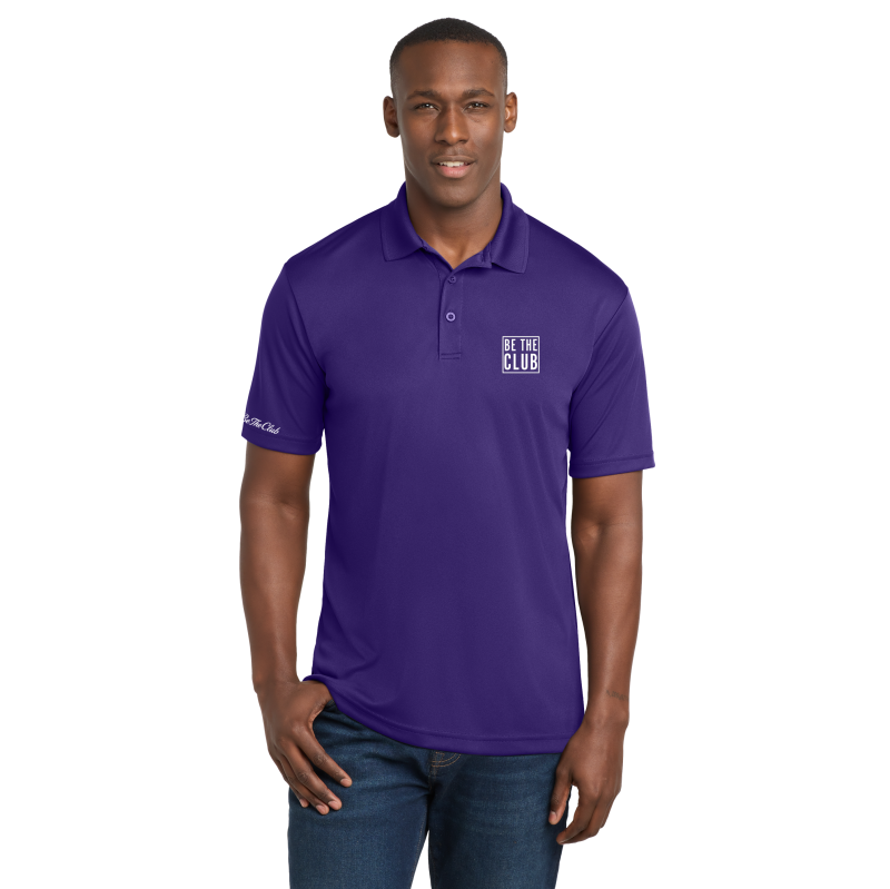 Man wearing a purple polo shirt with a logo on a white background