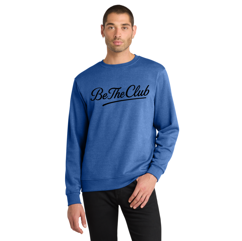 Man wearing a blue sweatshirt with 'Be The Club' text on a white background