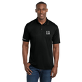 Man wearing a black polo shirt with a logo on a white background