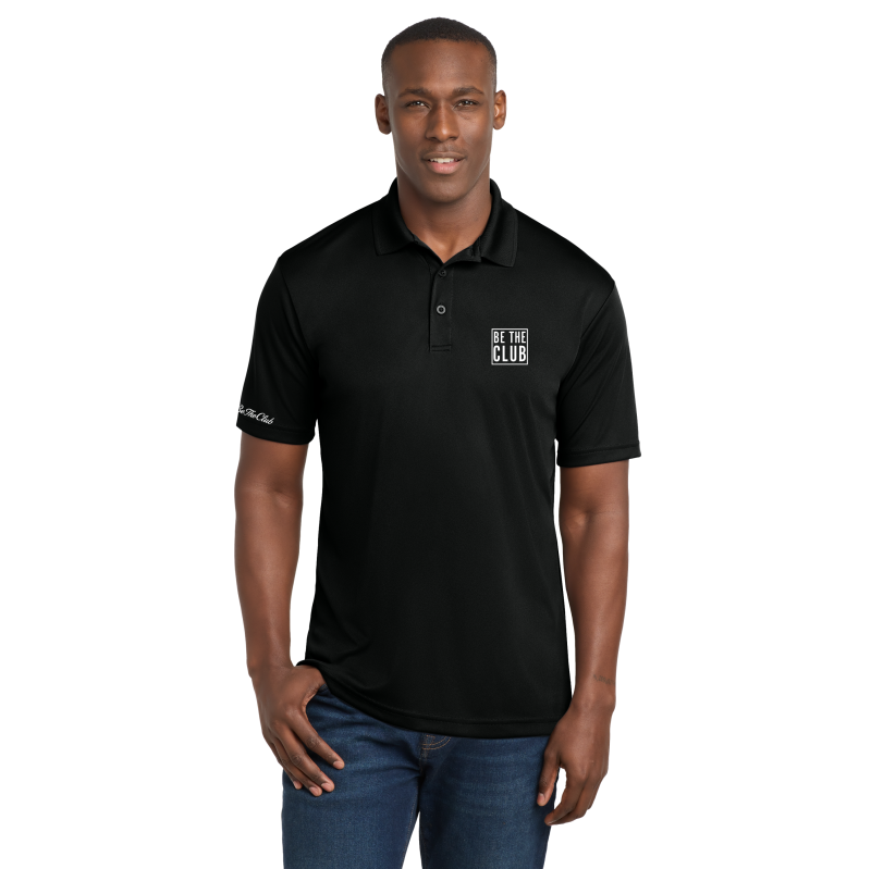 Man wearing a black polo shirt with a logo on a white background