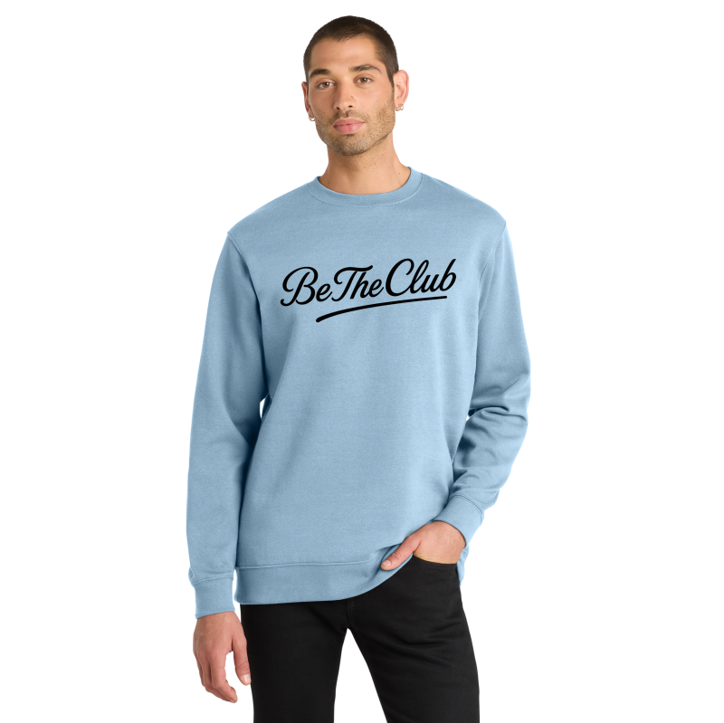 Man wearing a light blue sweatshirt with 'Be The Club' text on a white background