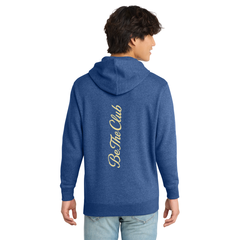 Person wearing a blue hoodie with 'Be The Club' text on the back, on a white background