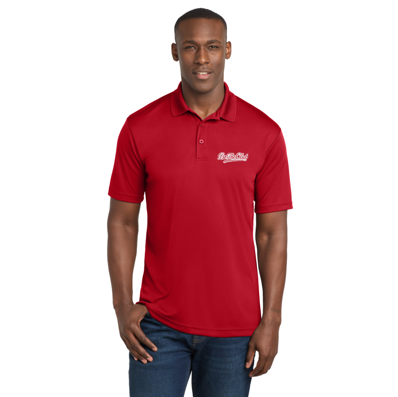 Man wearing a red polo shirt with a logo on a white background