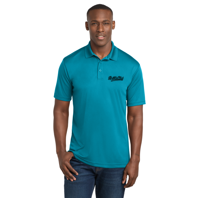 Man wearing a teal polo shirt with a logo on a white background