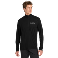 Man wearing a black long-sleeve shirt with 'Be The Club' logo on a white background