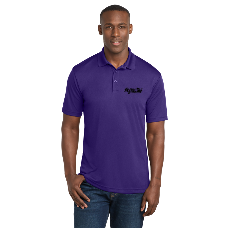 Man wearing a purple polo shirt with a logo on a white background