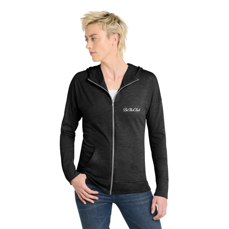 Person wearing a black hoodie with a logo on a white background